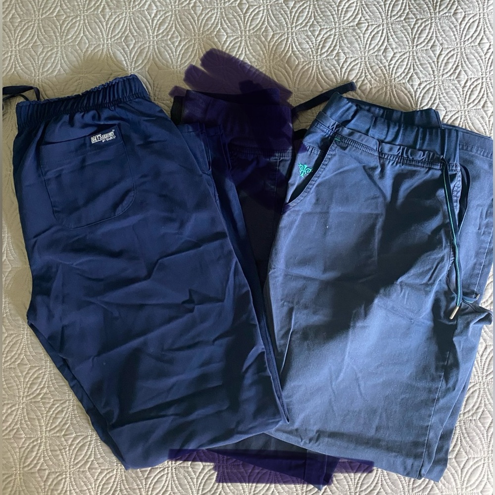 Two pair of Womens navy scrub bottoms. med couture medium, greys anatomy medium